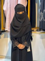 modest kids' long borka (abaya) set paired with a matching tiered niqab and a structured crown-style cap - Image 2
